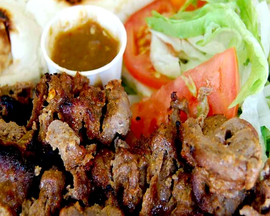 Behari kabab: grilled beef strips with naan, salad and a cup of chutney