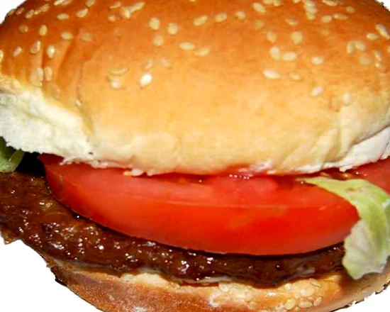 Beef burger with lettuce and tomato on a sesame bun